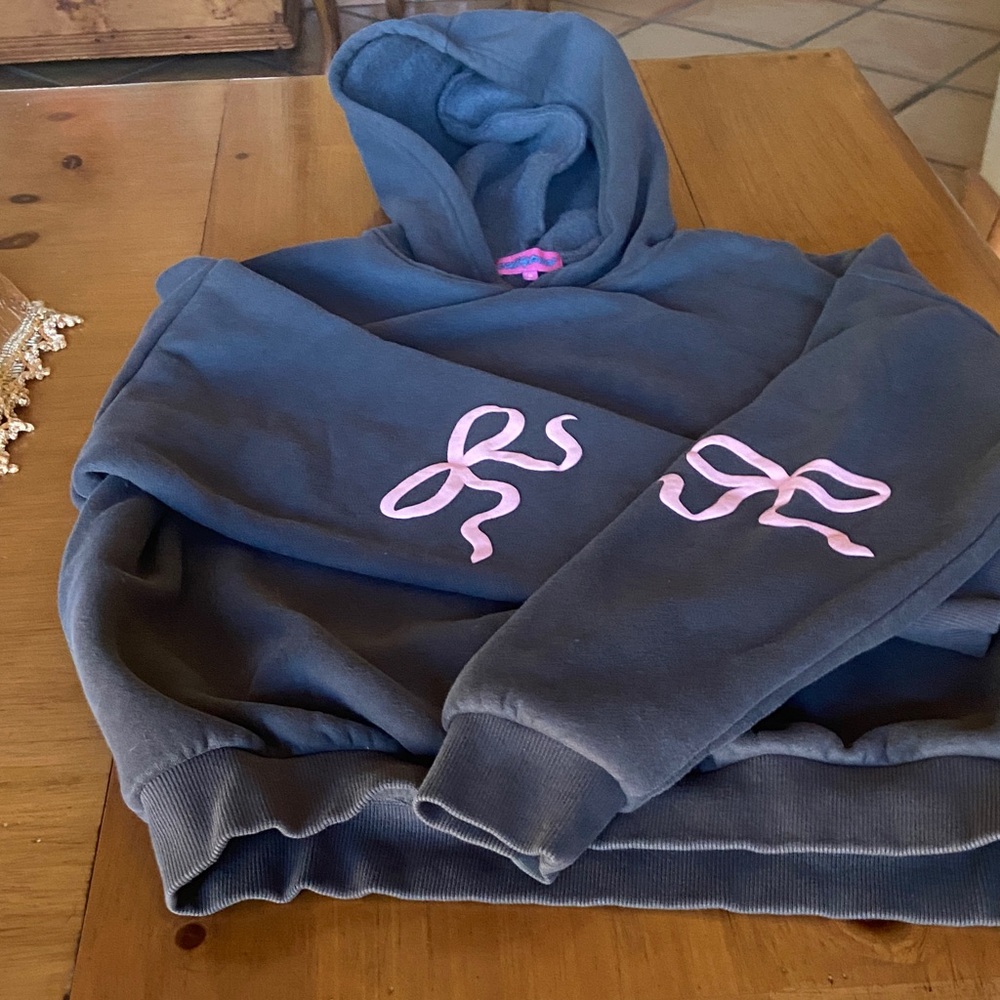 Ladies size medium Hoodie with Pink Bow Accents